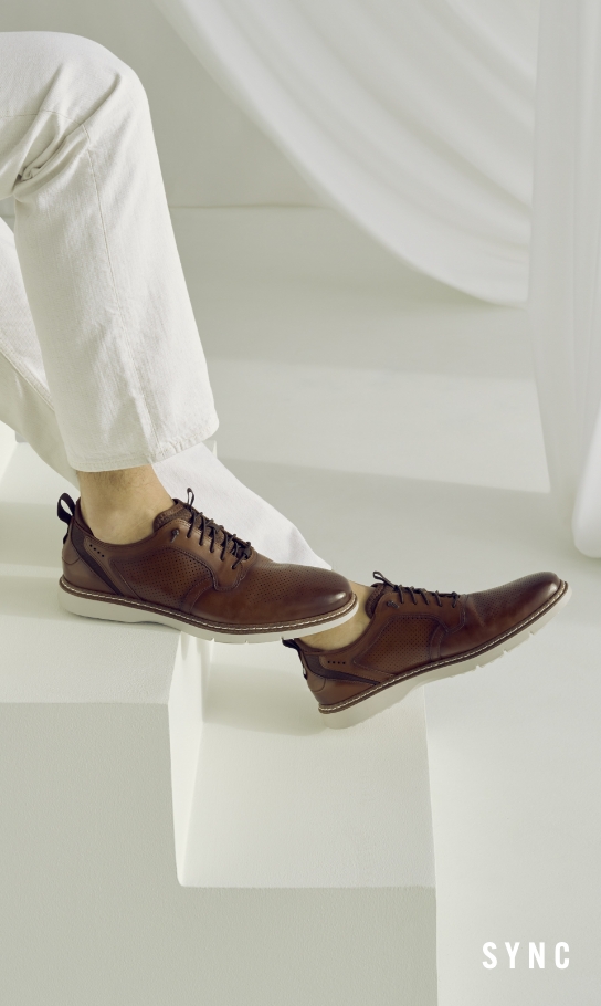 Men's Casual Shoes category. Image features the Sync in cognac. 