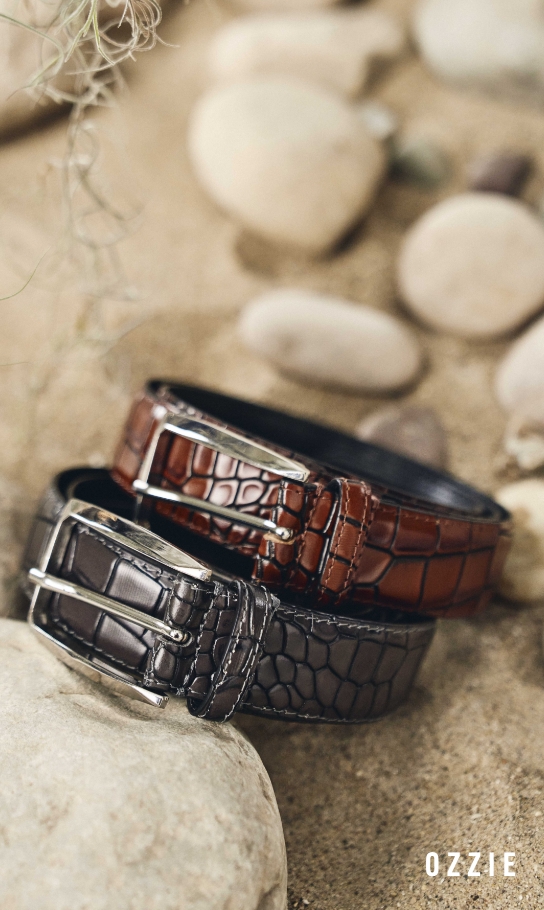 Men's Accessories view all category. Image features the Ozzie belt in tan & black.