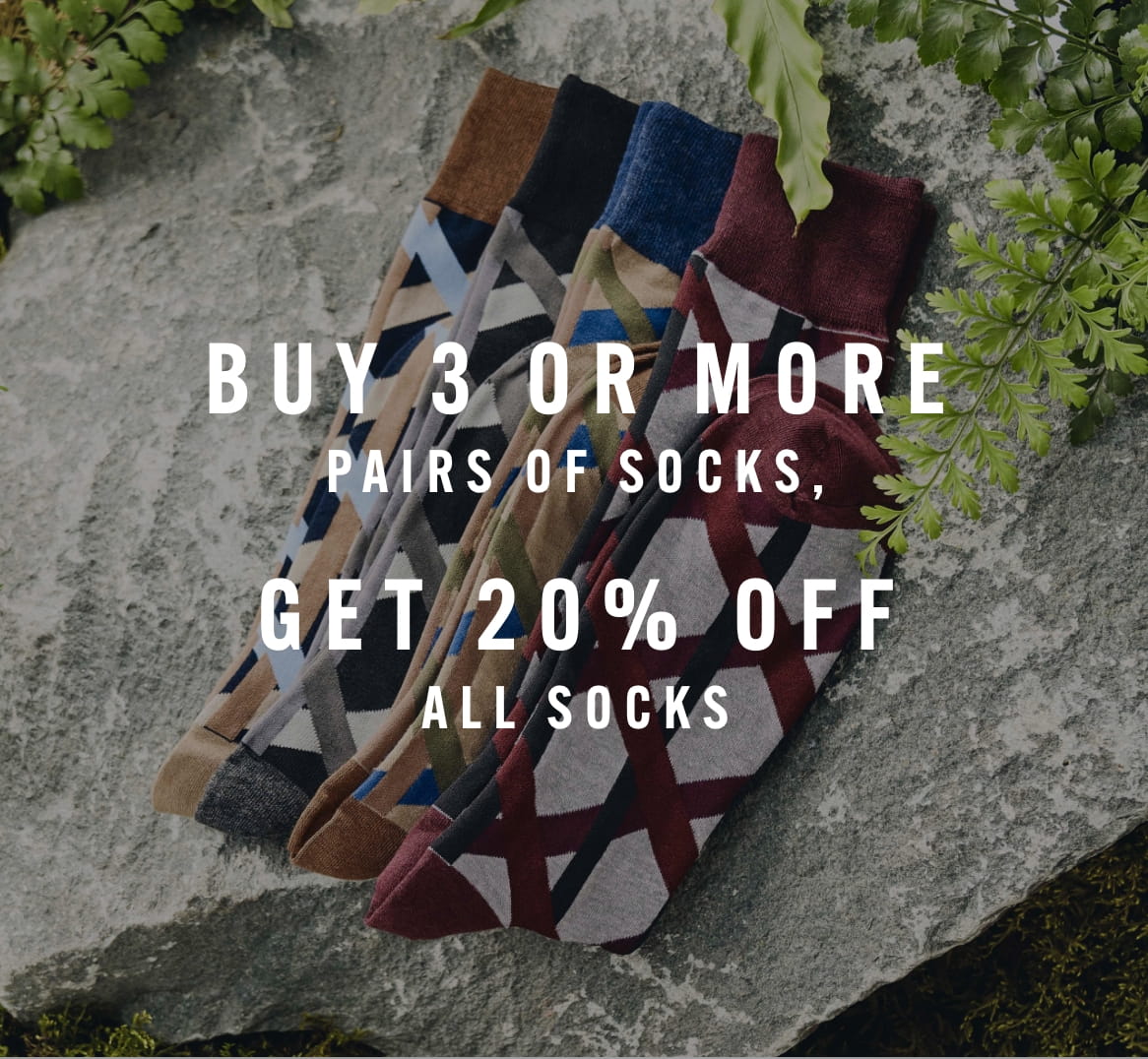 Click to shop Stacy Adams accessories. Image features a variety of socks.