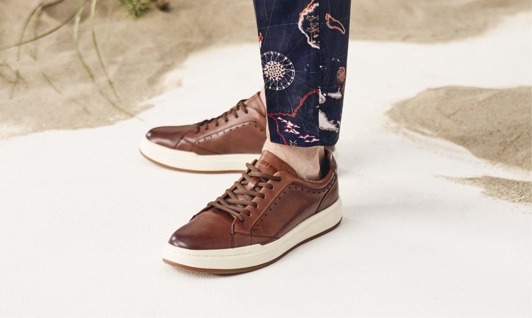 Click to shop Stacy Adams sneakers. Image features the collins in cognac.