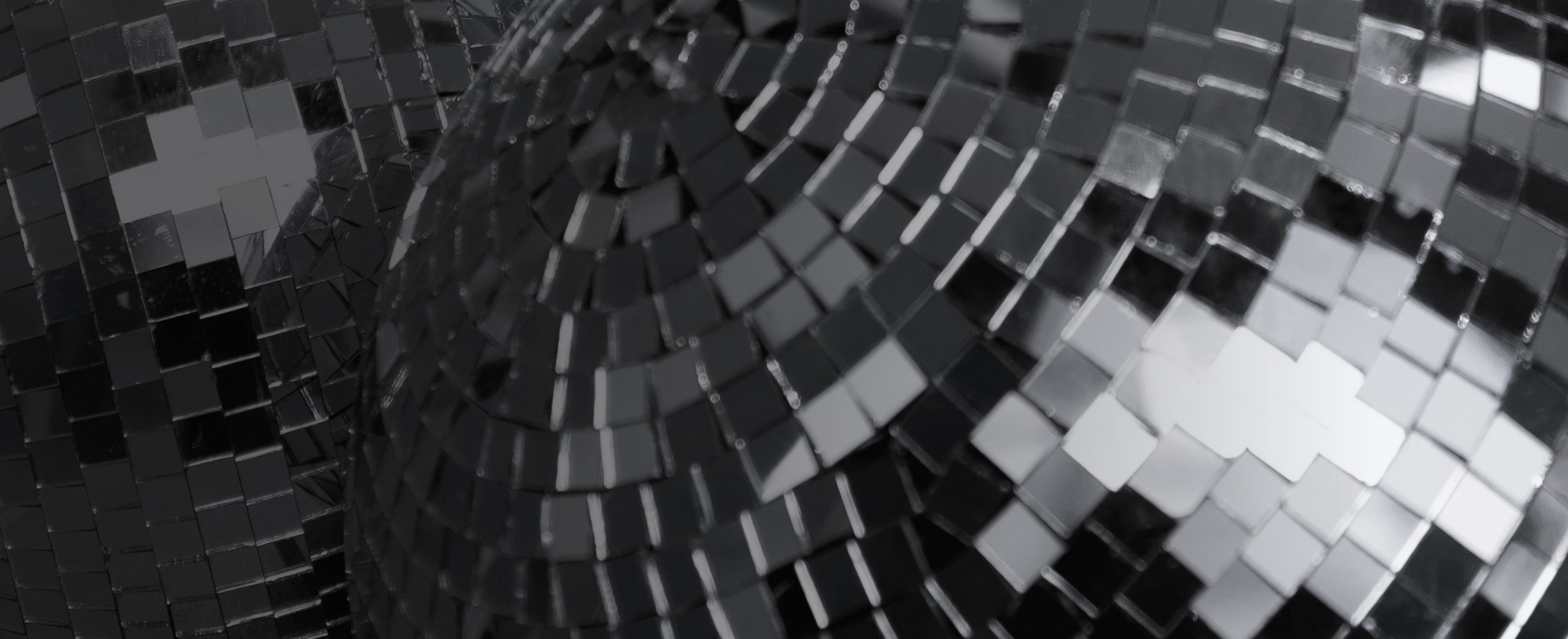 Buy one get one 50% off featuring a disco ball background.