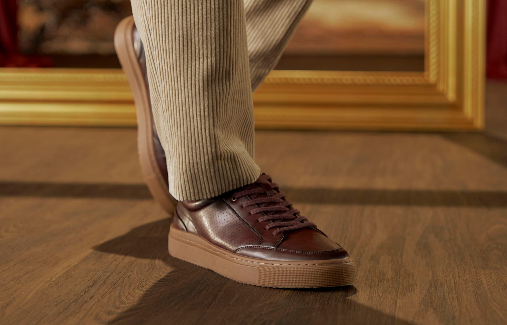 Shop Stacy Adams casuals featuring the Dorian in burgundy on a wood floor.