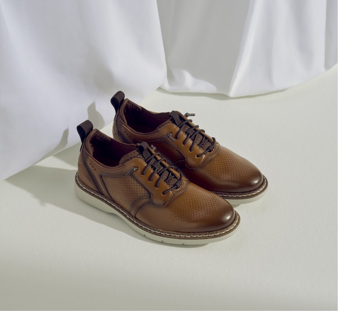 Click to shop Stacy Adams kids shoes. Image features the Sync in cognac. 
