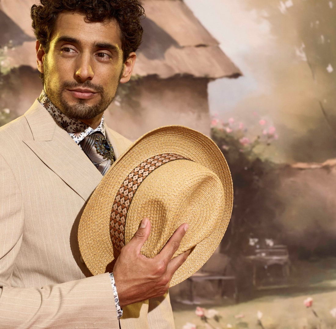 Shop Stacy Adams hats. Image features a woven fedora with a patterned band.