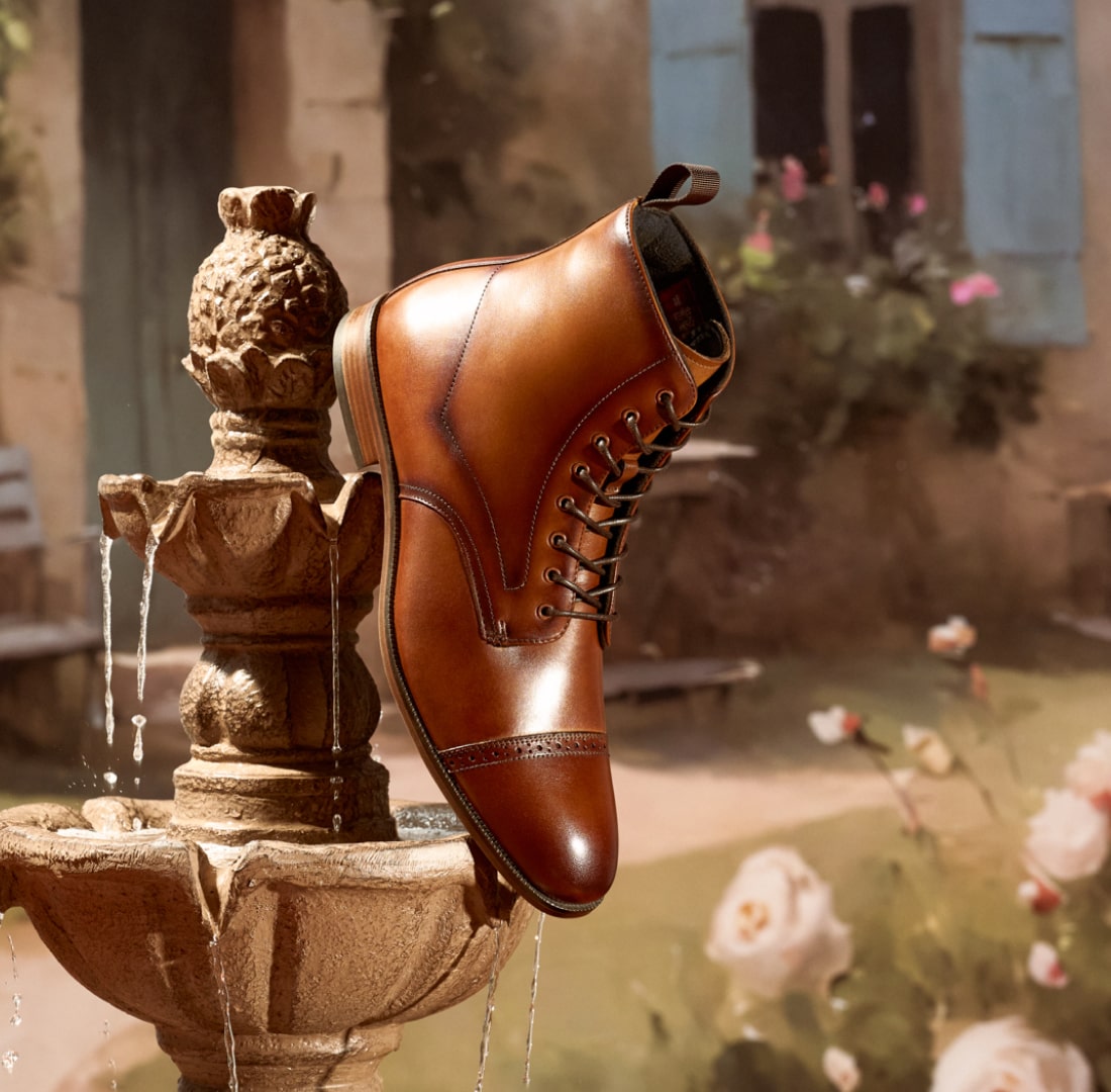 Shop Stacy Adams classics. Image features the Henry boot on a fountain.