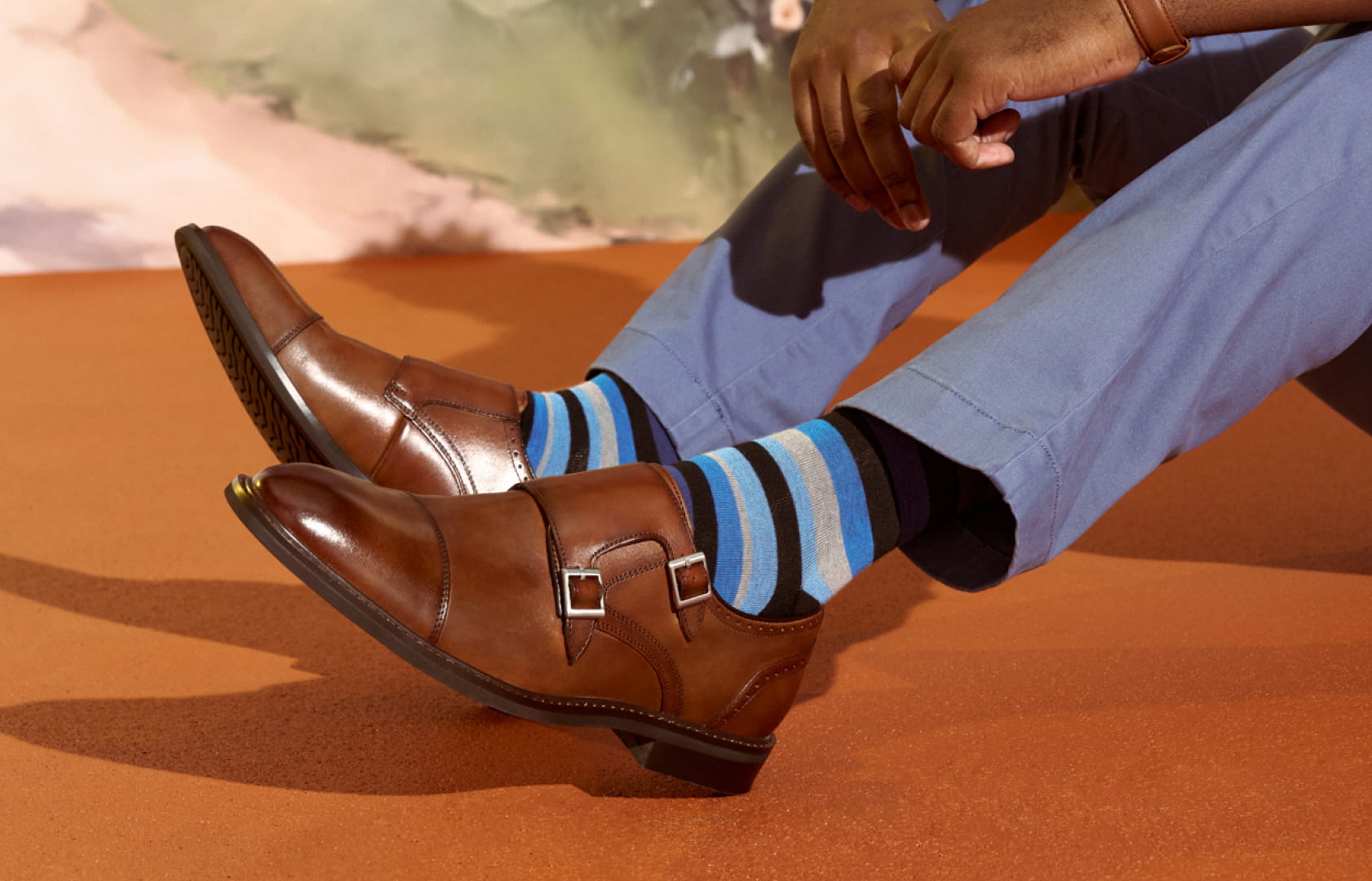 Shop Stacy Adams dress featuring cognac oxfords with blue striped socks and blue slacks.