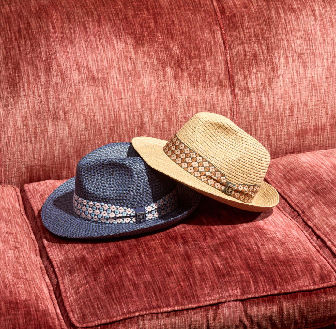 Shop Stacy Adams hats featuring 2 hats on a red sofa.