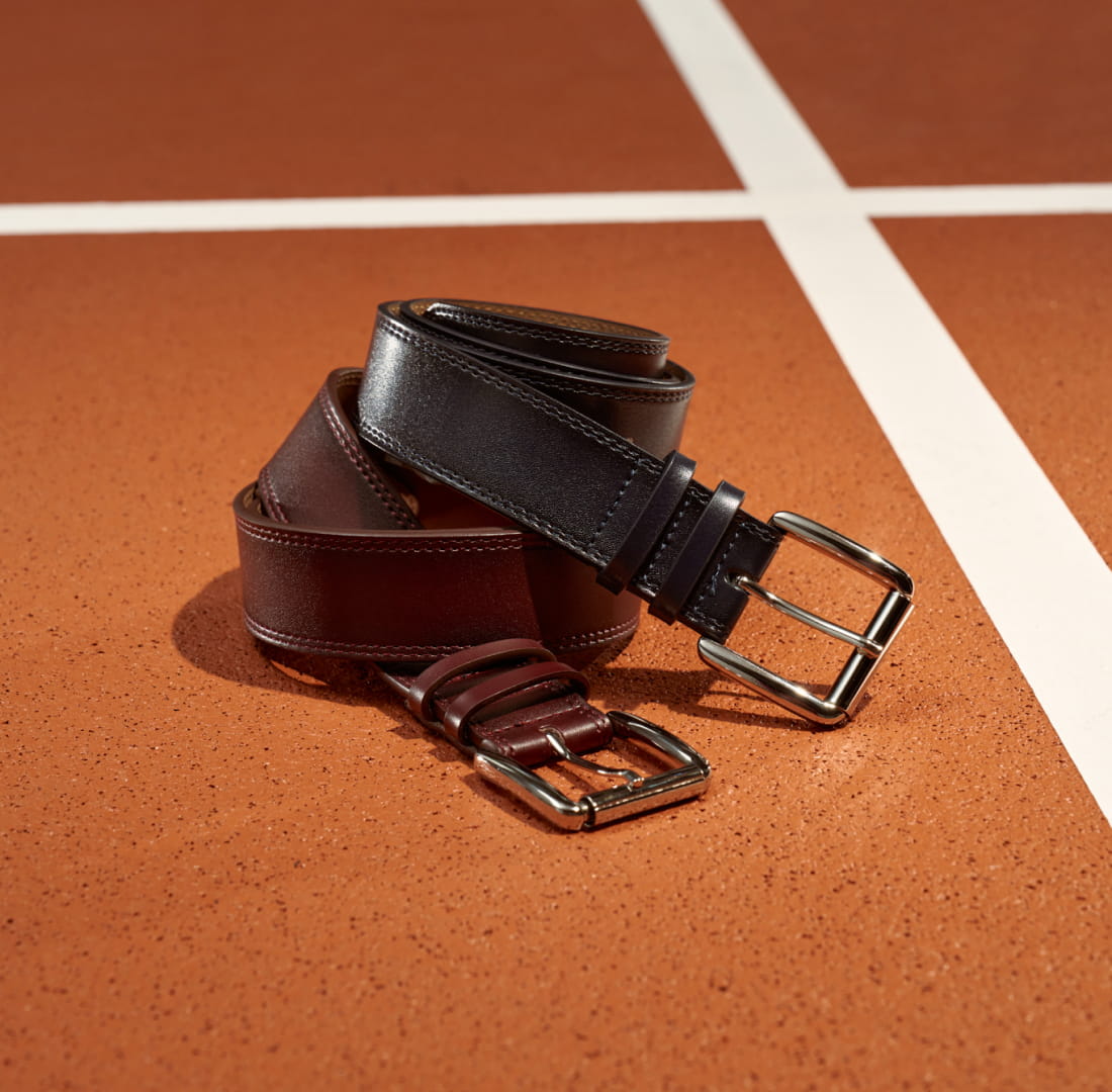 Shop Stacy Adams accessories. Featuring the Dylan belt on a pickleball court.