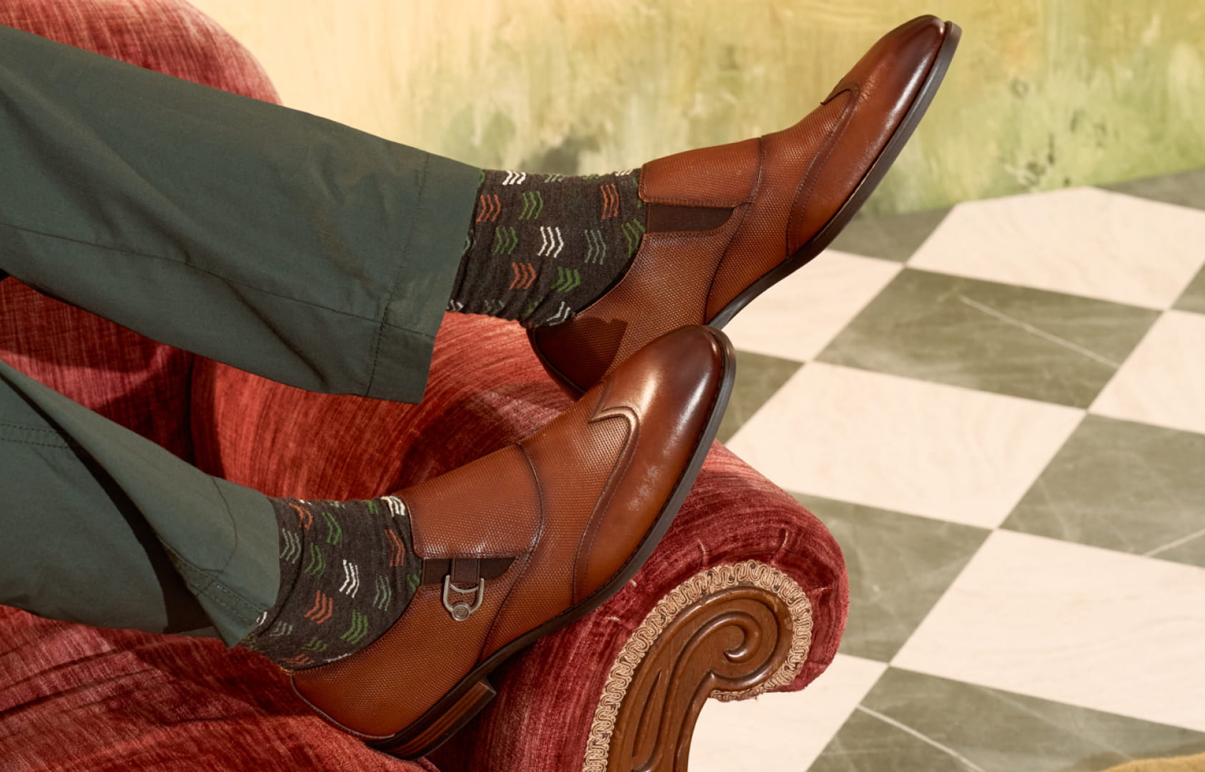 Shop Stacy Adams dress featuring the Lockwood in cognac on a red couch.