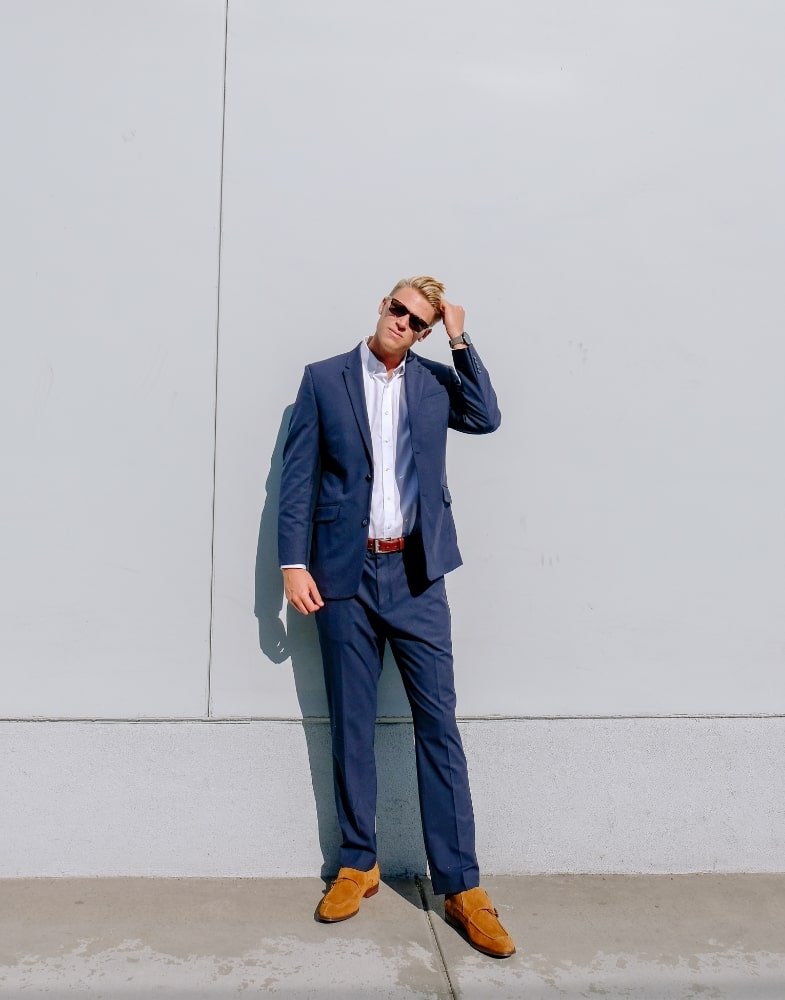 Image of social media influencer Drew Mellon from the duo "Beach Byrds" wearing the Balen Moc Toe Double Monk in Tan and posing for the camera.