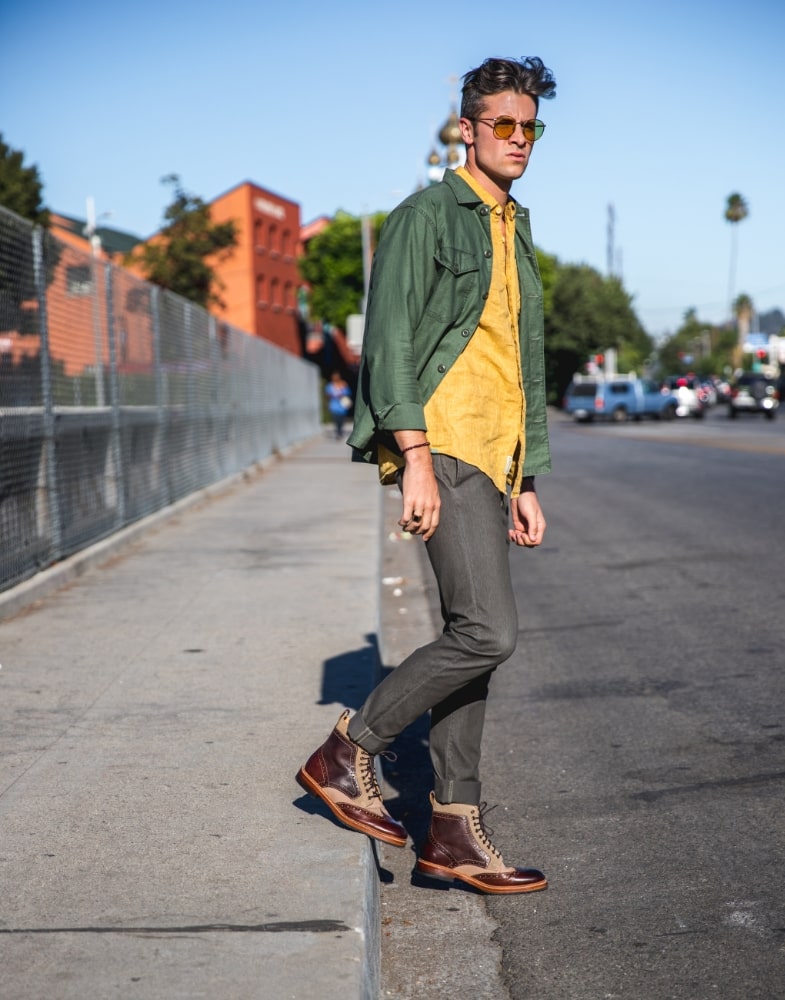 Image of social media influencer Parker York Smith wearing the M2 Wingtip Lace Up Boot in Brown Multi on a city street.