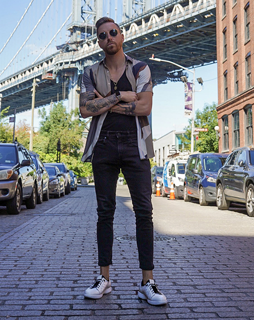 Image of social media influencer Jeremy Moore standing in the street wearing the Halden Cap Toe Elastic Lace Up in White.
