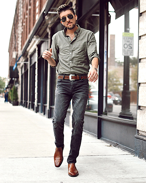 Image of social media influencer Thomas Trust walking on a sidewalk wearing the Perrin Plain Toe Chelsea Mid Boot in Cognac.