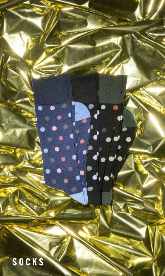 Men's Socks category. Image features polka dot socks on a gold foil background.