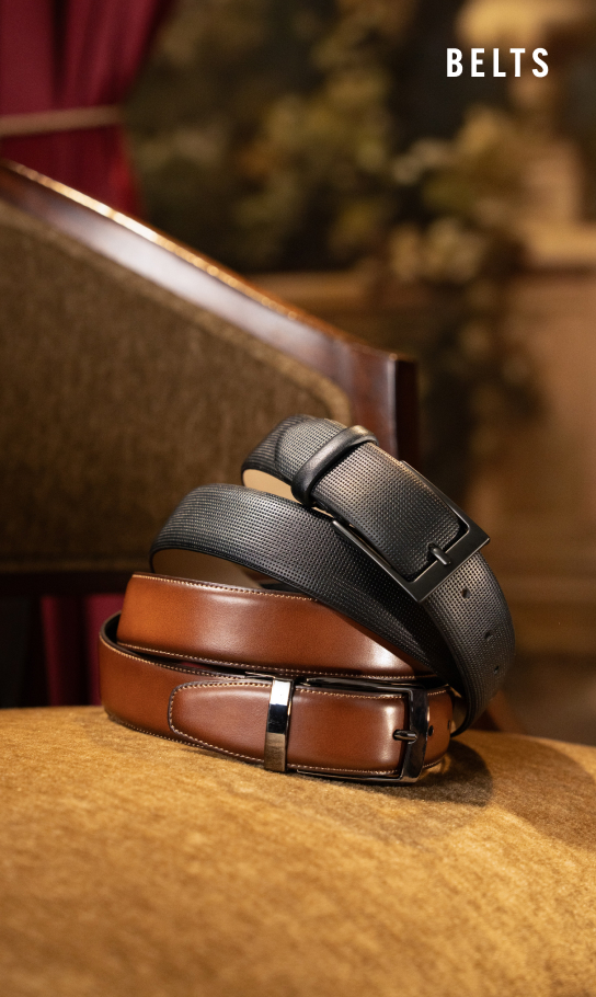 Men's Belts category. Image features belts on a suede chair.