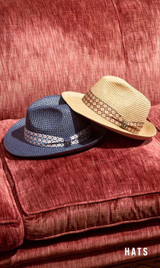 Men's Hats category. Image features 2 Stacy Adams hats on a red couch.