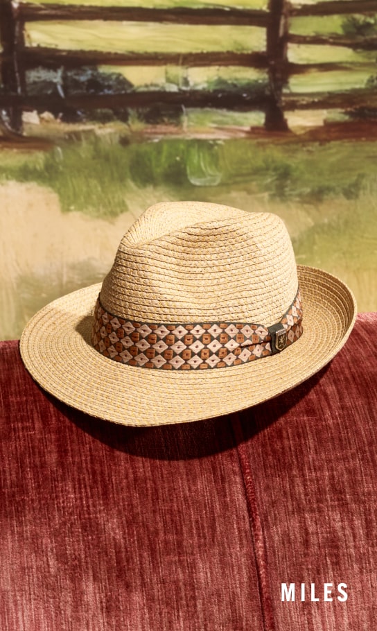 Men's Hats category. Image features the Stacy Adams Miles fedora on a red couch.