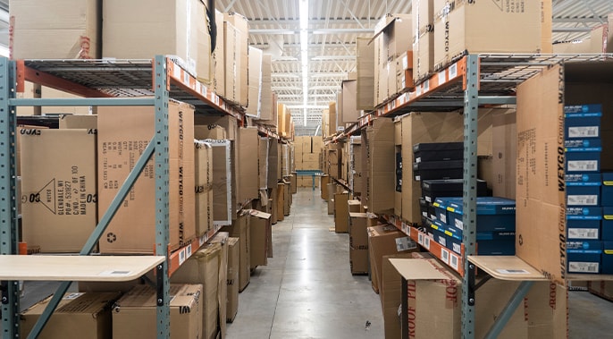 The featured image shows shelved boxes in the Stacy Adams Group warehouse. 