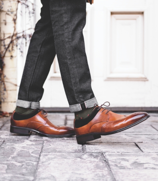The featured image is of a model wearing a Stacy Adams wingtip oxford shoe in Cognac and Black. 