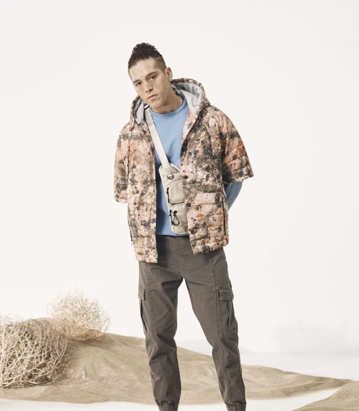 The featured image is a model wearing a multi-colored casual jacket and pants. 