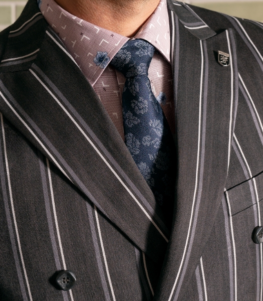 The featured image is a man wearing a formal suit.