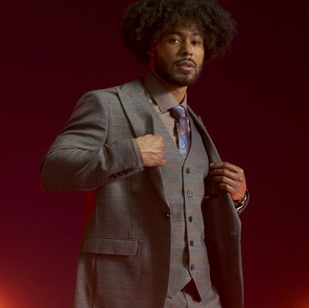 "Business Casual Outfits That Easily Transition From Day To Night." The featured image is a model looking off into the distance wearing a light-colored business casual outfit.