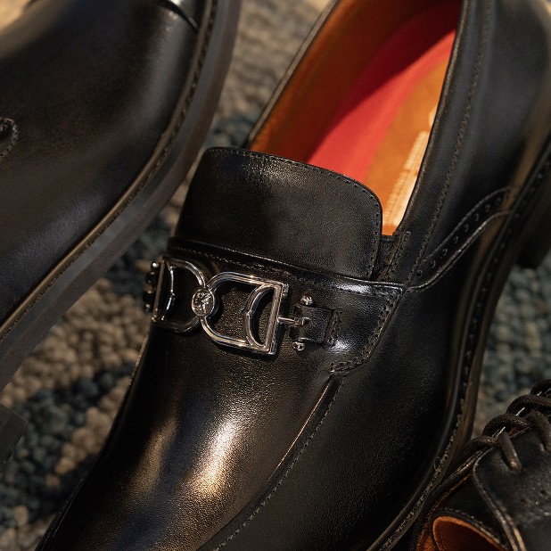 "What Is Business Casual? We're Here To Explain The New Rules." The featured image is of the Boyd Moc Toe Bit Slip On in black on a dark grey textured background.
