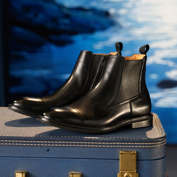 "The History Of Men’s Chelsea Boots." The featured product is the Joffrey Plain Toe Chelsea Boot in Cognac.