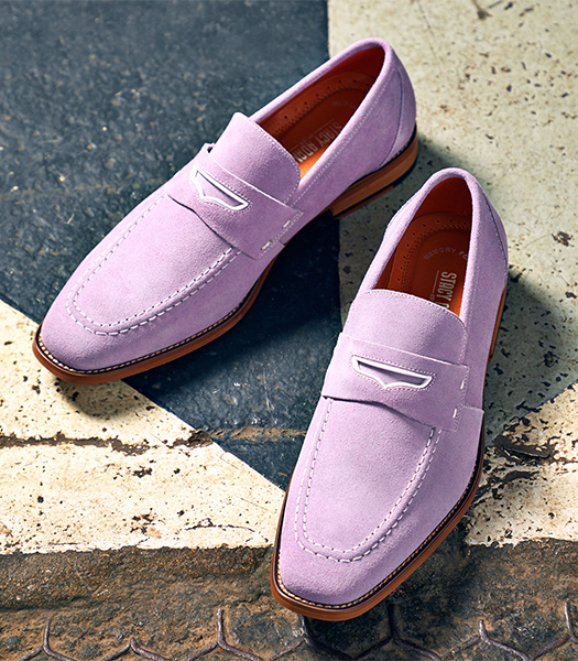 The featured shoes are pink penny loafers.