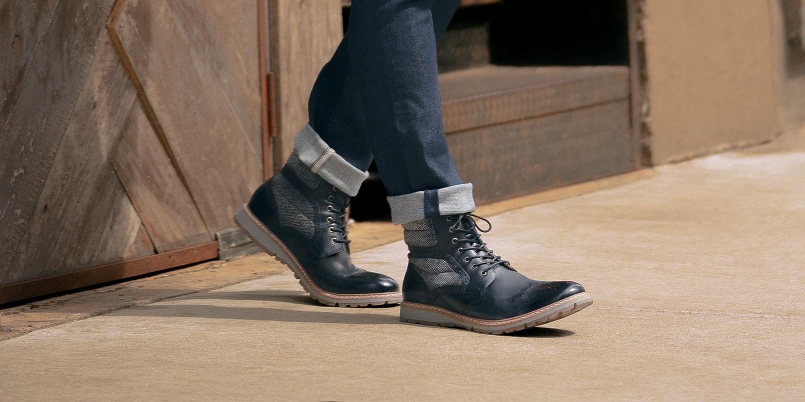 The featured product is the Granger Wingtip Lace Boot in Black.