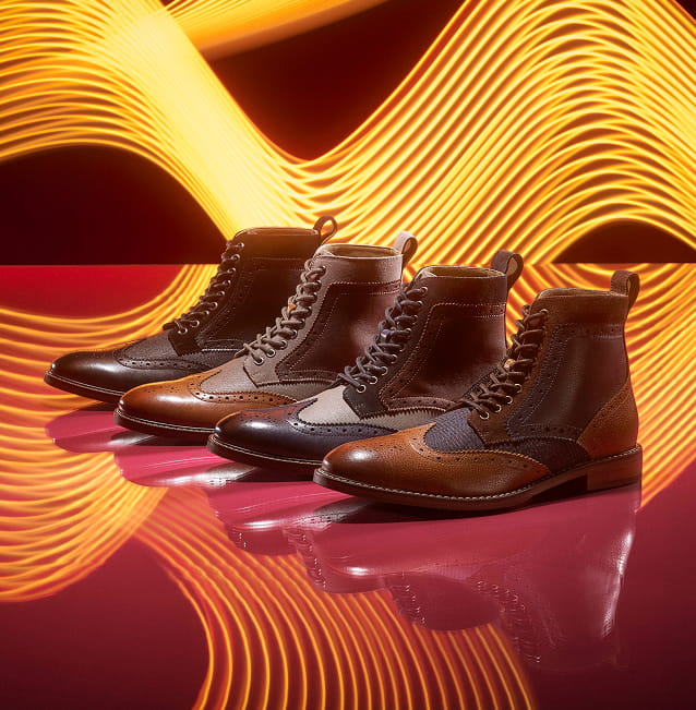 "Casual Shoes & Boots For All Seasons." The featured image shows a variety of Stacy Adams wingtip lace-up boots on a colorful, well-lit background.