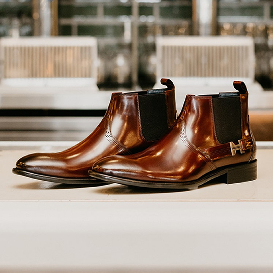 "The History Of Men’s Chelsea Boots." The featured product is the Joffrey Plain Toe Chelsea Boot in Cognac.