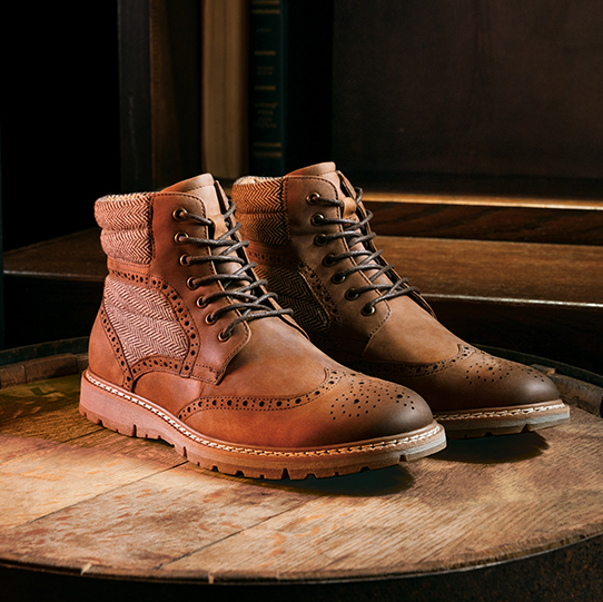 "Men’s Boots: A Storied History." The featured product is the Granger Wingtip Lace Boot in Brown Crazy Horse.