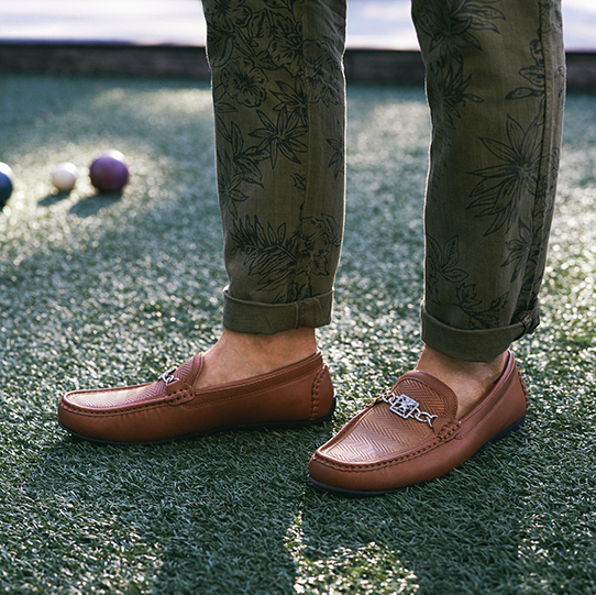 "Tassel, Bit, Or Penny Loafer: The Options Are Endless." The featured product is the Cygnet Moc Toe Bit Slip On in Tan.