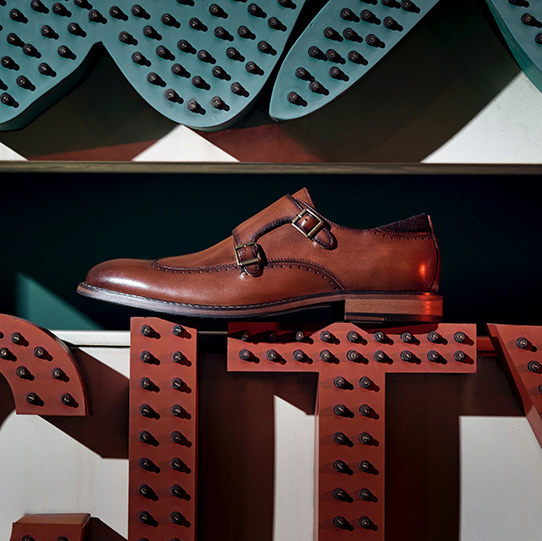 "Wide Shoes, the First Step to True Comfort." The featured product is the Farwell Wingtip Double Monk Strap in Cognac.