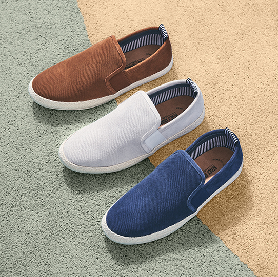 "Men's Travel Tips, The Right Shoes For The Road." The featured products are the Nino Plain Toe Slip On Espadrille in Cognac, Chalk, and Dark Blue.