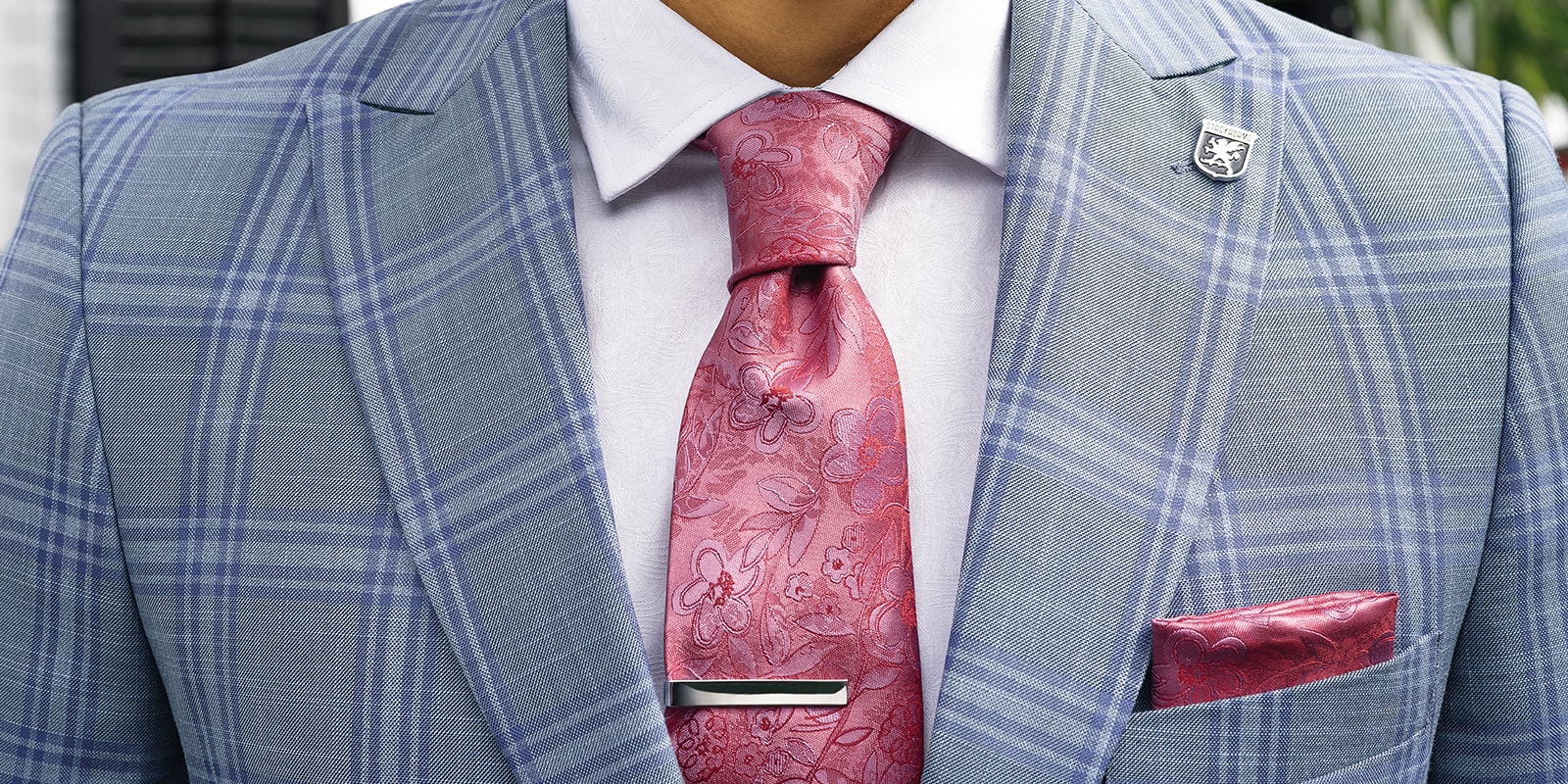 The featured image is a close up of a man wearing a formal suit, dress shirt, and tie.